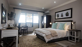 Room 2 luxury guesthouse suite with comfortable bedding, private accommodation and elegant decor at Hillside Guesthouse in Umhlanga Rocks