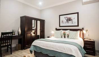 Room 5 luxury guesthouse suite with comfortable bedding, private accommodation and elegant decor at Hillside Guesthouse in Umhlanga Rocks