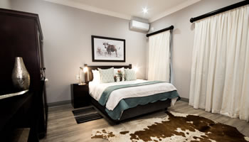 Room 5 bedroom at Hillside Guesthouse with quality percale bedding, air conditioning and stylish guesthouse interior in Umhlanga Rocks